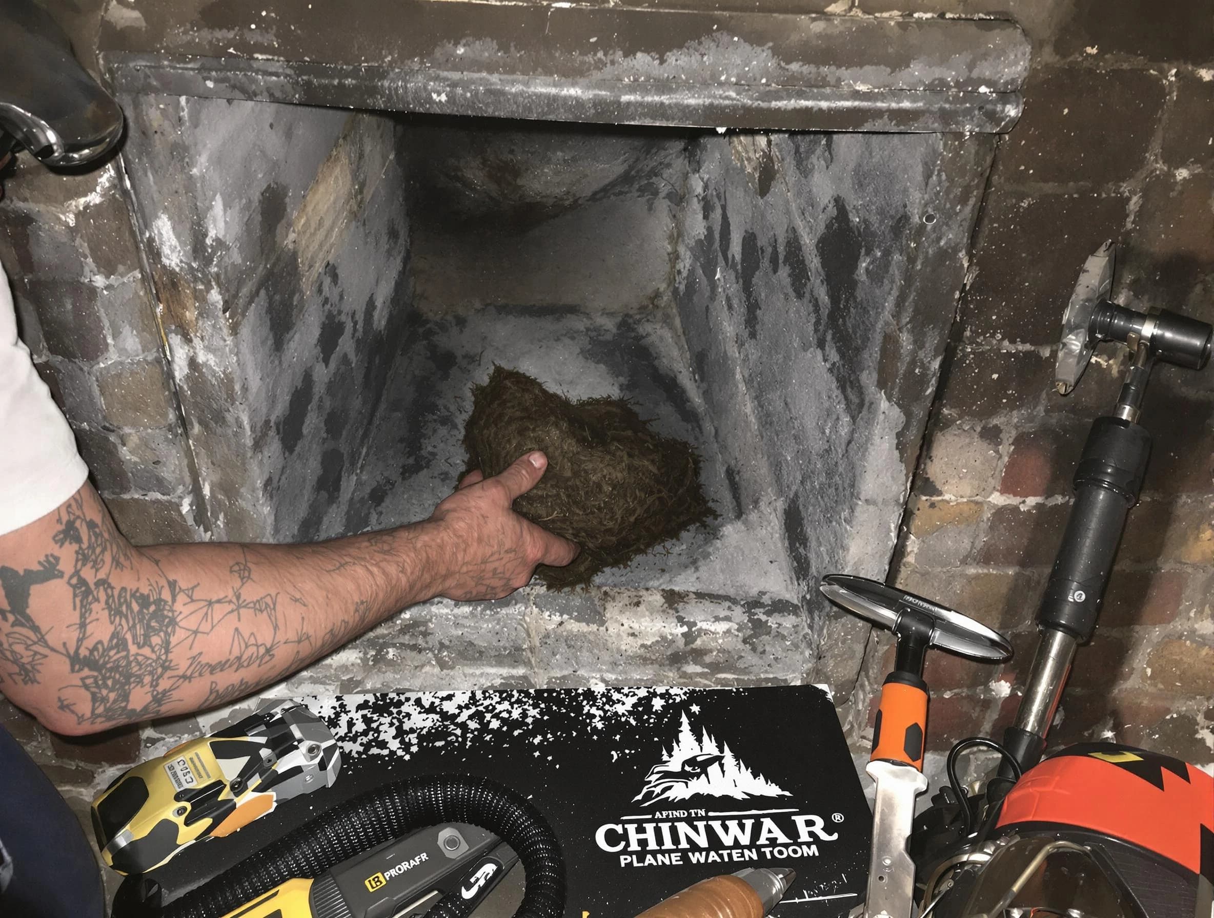 Richmond Chimney Sweep safely removing debris and screening chimney in Richmond, VA